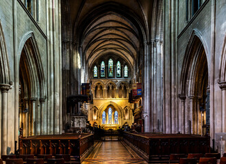 Central nave of St Patrick's Cathedral featuring soaring Gothic arches, stained glass and medieval atmosphere, heart of Ireland’s largest cathedral, Dublin, Ireland.