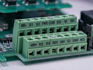 A double green terminal block on a printed circuit board.
