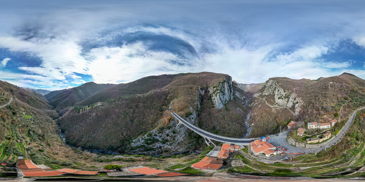 Drone shot of bridge between mountains near Triora with seamless 360 degree panorama