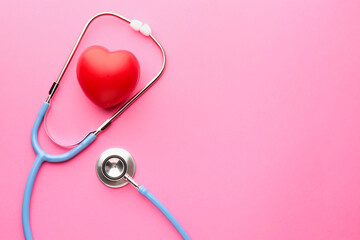 Fototapeta premium Stethoscope and red heart on pink background, flat lay. Space for text