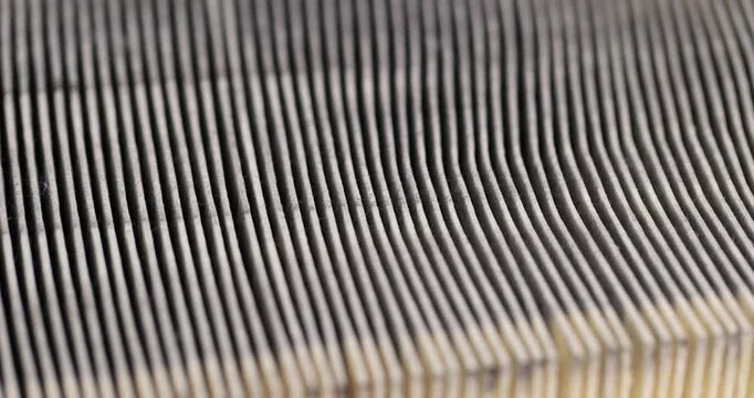 an old filter for cleaning the air in the car, a dirty old and long-used paper filter for cleaning the air in the car engine