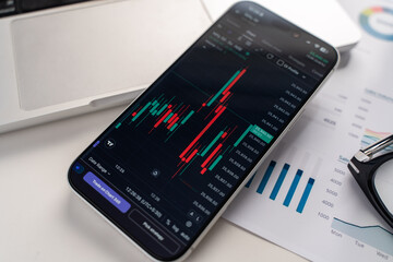 Trading chart on phone screen in Bangalore, India, on February 04, 2026
