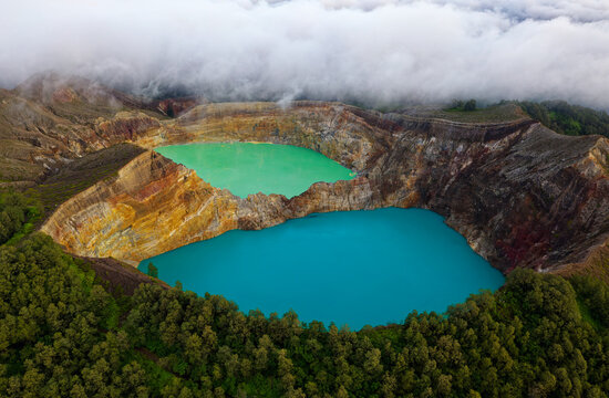 Kelimutu volcano close to Moni in Flores island in Indonesia, three volcanic crater lakes that differ in color, blue Tiwu Ata Mbupu, green Tiwu Nua Muri Kooh Tai and red Tiwu Ata Polo, changing colors