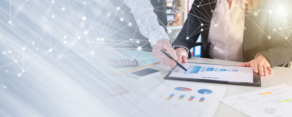 Business people talking about business performance; panoramic banner