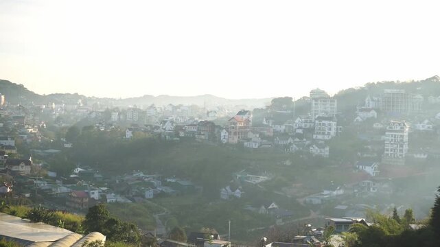 Vietnam, Da Lat Da Lat Hillside Cityscape At Sunrise, Soft Mist Drifting Through Valley, Rows Of Pastel Buildings Clinging To Slopes, Winding Roads And Terraced Fields, Warm Golden Hour