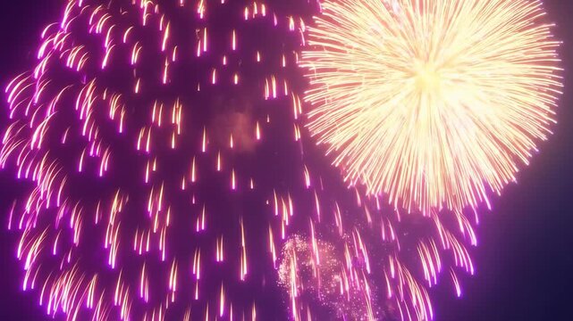 Fiery Sky Spectacle: A vibrant tapestry of light explodes in the night sky, showcasing dynamic firework displays that paint the darkness with streaks and bursts of radiant color.