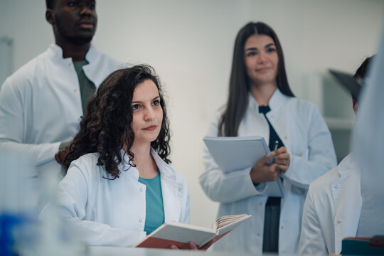 Diverse students learning in a scientific lecture