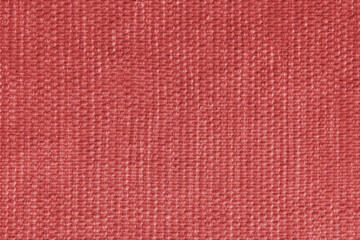 Fototapeta premium Red upholstery fabric, textile texture with detailed woven textile pattern, close up, macro. Cloth background for interior design, furniture, wallpapers, decor, packaging and creative backdrops.