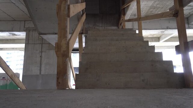 Low angle view of an unfinished concrete steps, construction site under development.