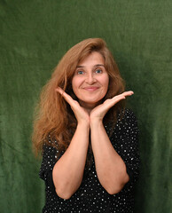 Woman with long hair on a green background,