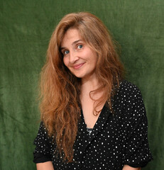Woman with long hair on a green background,