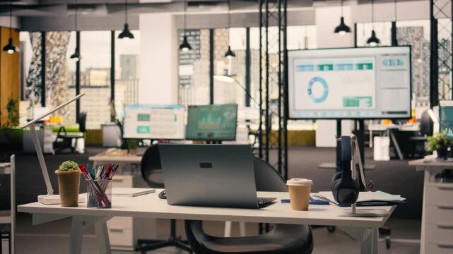 Professional business interior with modern desk setup and office supplies, comfortable office space with furniture and stationery. Big windows provide bright natural light, skyline from downtown.