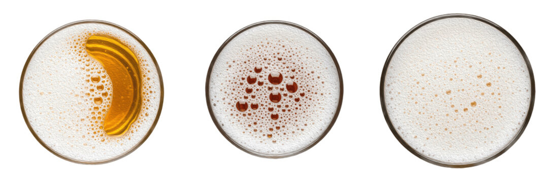 Top view of three beer glasses with foam and bubbles isolated on white background