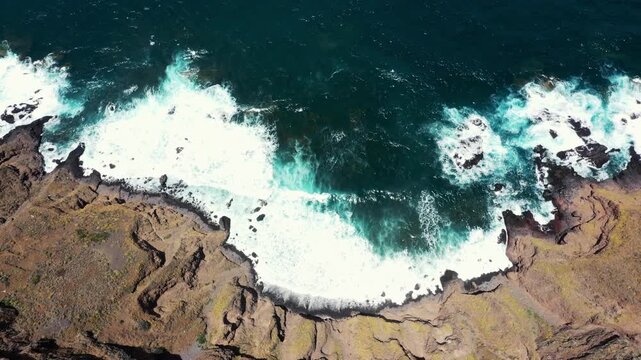 Aerial top down view from Mirador La Goleta showing cliff drop and waves crashing below Tenerife