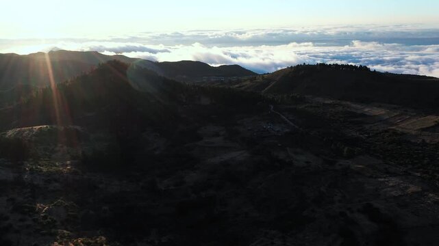 High altitude drone flight over Chinyero volcanic landscape at golden hour Tenerife travel destination