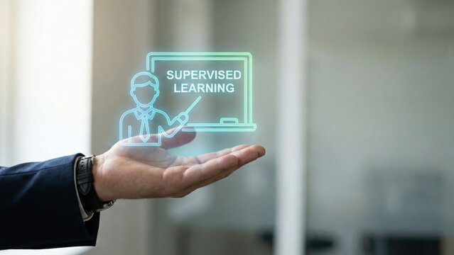 Supervised learning visual machine training concept hologram above business hand illustrating algorithm model teaching and prediction modern