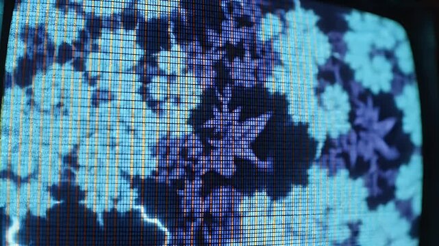 Close-up of a digital screen displaying abstract blue patterns and bright white lightning-like streaks