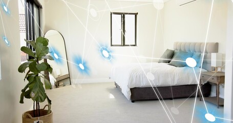 Displaying bed with tufted headboard and white duvet in minimal bedroom, plant, digital overlay