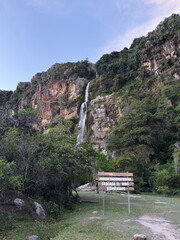 Wine Waterfall in Dinira National Park, Venezuela, with towering cliffs and lush forest