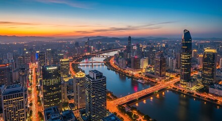 City skyline at sunset with river and illuminated buildings