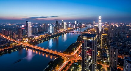 Obraz premium Cityscape at dusk featuring modern architecture and a river at twilight