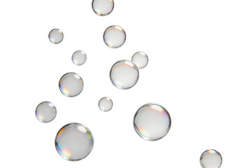 Numerous transparent soap bubbles floating in mid-air, showcasing delicate light reflections and refractions on their surfaces, ideal for abstract or background use.