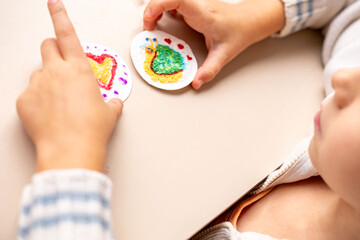 joyful child artist, little girl holding snail, heart snail draw on fluffy sponge painting paper, Childhood creativity 3D textured canvas art paper painting, preschooler imagination, round shape card © kittyfly