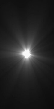 Abstract loop center flickering glow white star optical shine light lens flares animation on black background. seamless loop dynamic kinetic bright star light rays effect. Abstract optical lens flares