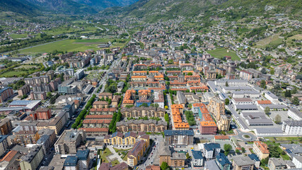 Aerial Drone View of Aosta Residential District with Apartment Buildings and Alpine Surroundings, Italy