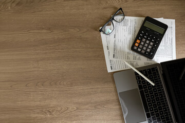 Top view tax workspace with copy space, showing tax forms, calculator, tax filing preparation, accounting services, tax season filing deadline