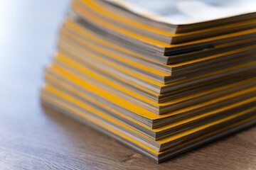 Close up stack file folders and documents office desk, representing paperwork backlog, records management, compliance filing workload document organization