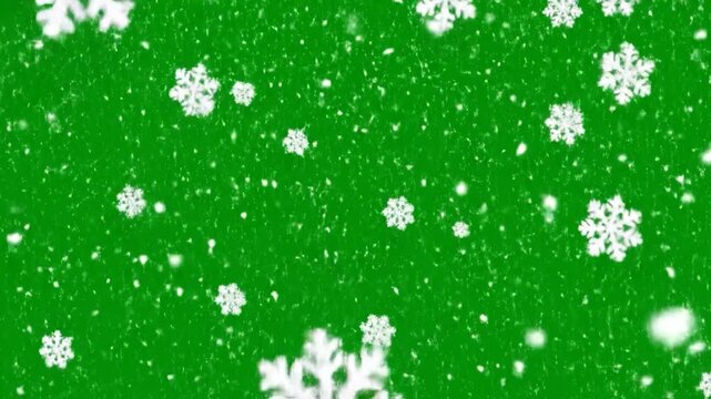White snowflakes gently falling against a vibrant green background