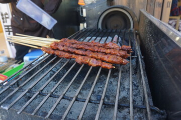 Grilled yak meat on skewers is a popular dish among tourists in Lijiang, Yunnan Province, China.