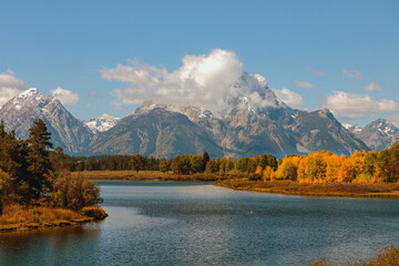 Snow-Capped Mountain Reflection in Autumn River Landscape