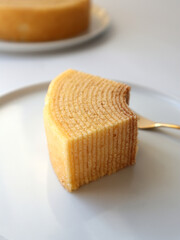 Japanese baumkuchen sponge cake slice isolated on white background