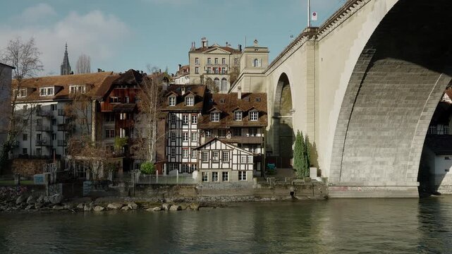 River Flowing Through Bern with Bridge and Historic Houses
