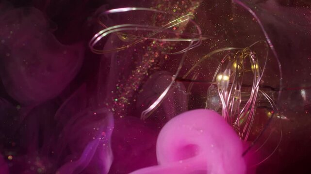 Haze wave defocused. String garland glow. Broken glass bokeh light bulb abstract sparkling water. Pink yellow color ink smoke black background.