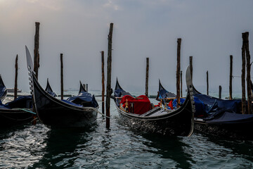 Moored Gondolas on a Misty Venetian Lagoon