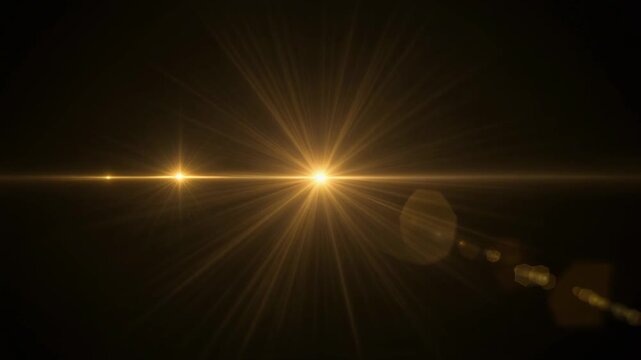 Gold glow optical flare animation featuring luminous starburst rays, shimmering highlights