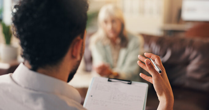 Man, therapist or counseling with clipboard for advisory, therapy session or psychology. Male person, psychologist and talking with client or notes for understanding, emotional support or trauma help