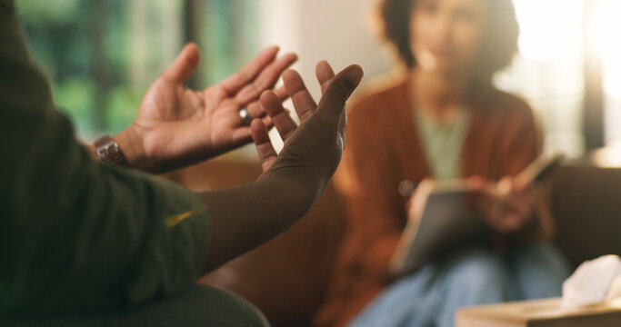 Hands, psychologist and consultation for mental health, therapy or notebook for support in office. Client, counseling and person with depression, psychiatry and notes to help with anxiety assessment