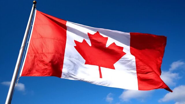 Canadian Maple Leaf: A vibrant Canadian flag waves proudly against a brilliant blue sky, the iconic maple leaf emblem at its heart. Evoking national pride and the spirit of Canada.