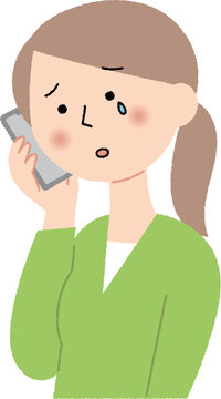 泣きながらスマホで相談する女性