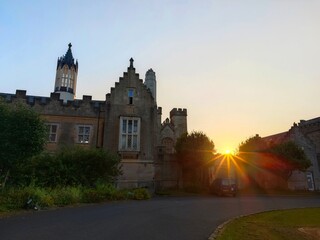 ULVERSTON, ENGLAND - AUGUST 13, 2025: A view of the Gothic Revival facade of the Manjushri Kadampa Meditation Centre at sunset. 