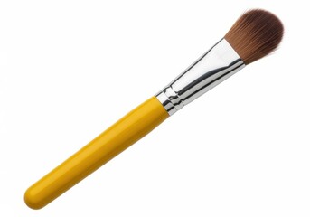 Fototapeta premium Yellow handled cosmetic applicator with brown synthetic bristles is positioned diagonally on a white background.