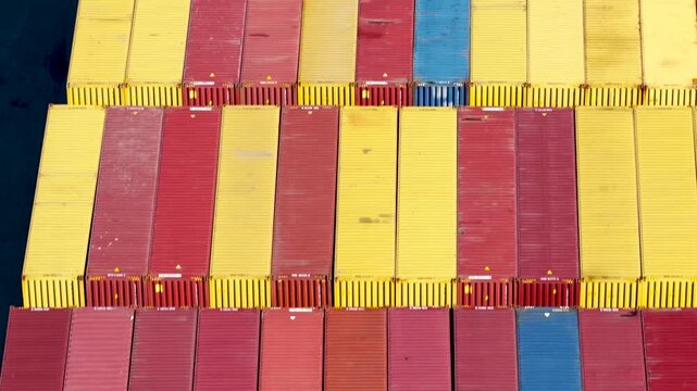 Aerial view of colorful shipping containers at a container port.
