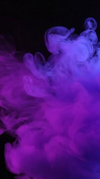 Vibrant purple and blue smoke billows against a dark background