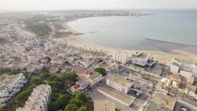 Aerial Drone View of Le Grau-du-Roi Coastline By the Mediterranean Sea At Wintertime Aerial, seaside town, sandy beach and calm sea