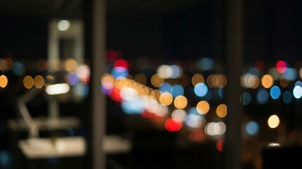 Fototapeta premium Abstract Blurred City Lights at Night from an Office Window with Colorful Bokeh