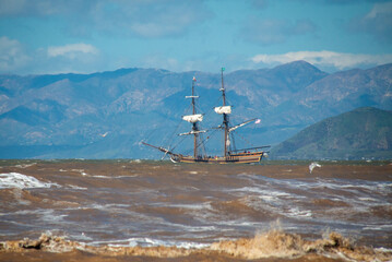 Wooden sailing ship in rough seas off the California coastline near Ventura California United States © htrnr